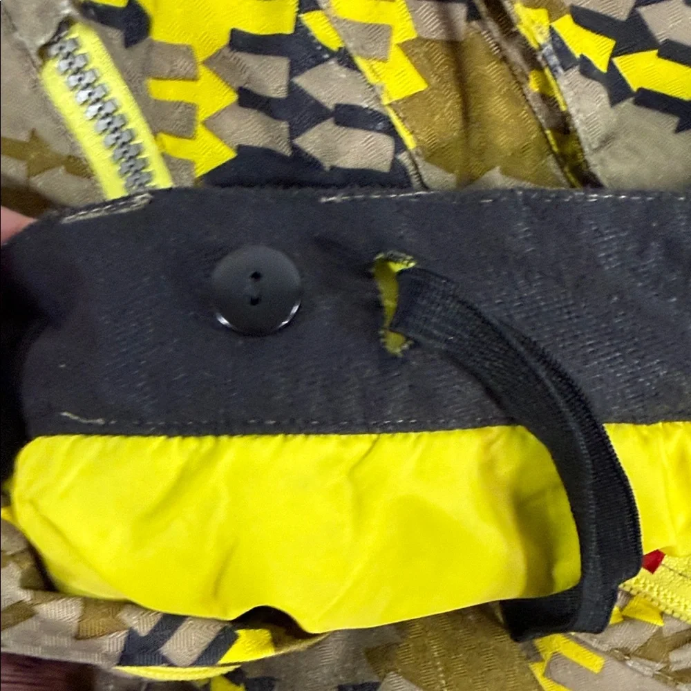 SPYDER Boys' Propulsion ski pants with an olive, black, and yellow plaid pattern